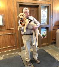 Pike County Treasurer John Gilpin and his puppy Maine.