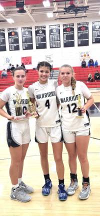 DV girls’ varsity basketball wins against Newburgh Ciara Newton, #4, was named the tournament MVP and Amanda Aragona, #12, was named to the all tournament team. Jordan Dickerson, #10, holds the team’s championship trophy.