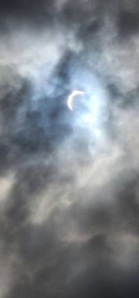 The moon covers much of the sun Monday afternoon, April 8, as seen from the Wallkill River National Wildlife Refuge in Sussex. (Photo by Gulbadan Habibi)