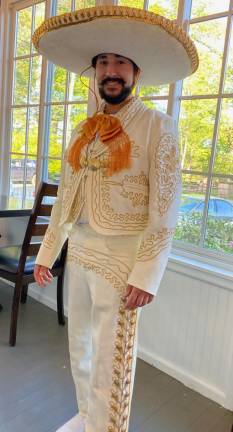 Miguel Gonzalez, son of Miguel Gonzalez, chef at La Posada. This young man works on a Norwegian cruise ship based in Hawaii, and was here for the celebration. Photos by Marilyn Rosenthal.