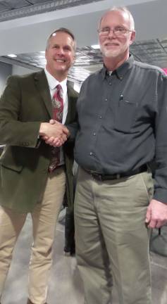 Milford Borough Mayor Bo Fean resigns Patrick Beck (left), the new council president, shakes hands with Mayor Bo Fean back in January, as the newly organized board called for unity. It didn't work out. (Photo by Frances Ruth Harris)
