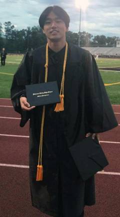 Yoshi Sumitomo at his graduation (Photo provided)