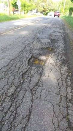 More Sawkill Road potholes need attention Crumbing Sawkill Road (Photo by Frances Ruth Harris)