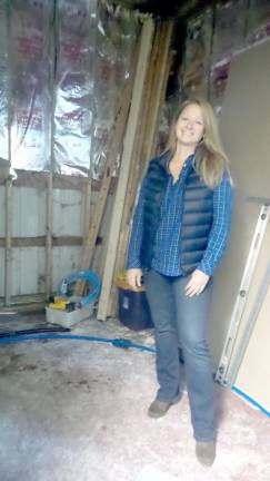 Post 139 Commander Connie Harvey in the area that will be the men's handicapped restroom.