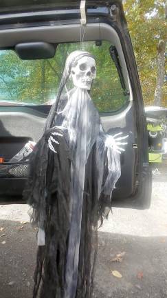 This red-eyed skeleton welcomed children to Trunk or Treat (Photo by Frances Ruth Harris)