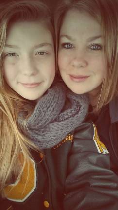 Mother Daughter Look A Like Contest Photo submitted by Kristin Noll of Stockholm "This is my oldest daughter Karleigh, and me. She is such a joy in my life. Mini me doesn't even begin to describe her, she is very like me in some good and bad, haha. Her stubbornness is good and bad but her generosity is her heart and soul. She loves to help others in need and plays an elf every Christmas to give gifts from Santa to the families in need from the Community Outreach Program in Hardyston which I started 10 years ago. We believe in helping others and our rewards are the smiles we get in return, that to us is priceless. We may not have the finer things in life, but we have each other."