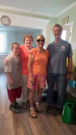 Pantry packs boxes of sunshine for Pike seniors From left: volunteer Sherman Williams, food pantry director Nancy Potter, sunshine box recipient Barbara Macali, and volunteer Jim Snodgrass (Photo by Frances Ruth Harris)