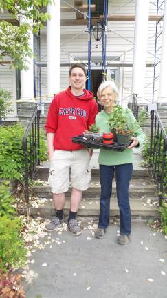 Gardens grow with help from annual plant sale Kyle Brown, Susan Brown’s son and helper, with Sally Gifft (Photo by Frances Ruth Harris)
