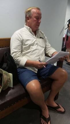 Don't stop the music, residents say Don Quick reads from Pennsylvania's right-to-farm law (Photo by Frances Ruth Harris)