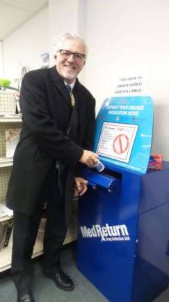 Matt Osterberg at the launch of the Village Pharmacy prescription drug drop box, which he worked to make happen. (Photo by Frances Ruth Harris)