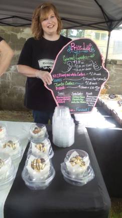Milford gets fresh Janette Kislak offers specialty cupcakes from Wonderland’s Tea Party at the Milford Farmers Market (Photo by Frances Ruth Harris)