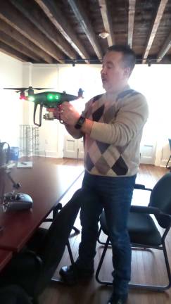 Frank Segarra, President of Connexicore, shows one of his drones (Photo by Frances Ruth Harris)