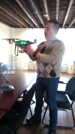 World drone fleet ConnexiCore moving to Milford Frank Segarra, President of Connexicore, shows one of his drones (Photo by Frances Ruth Harris)