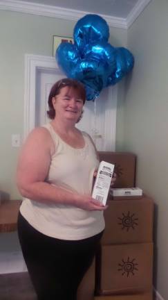 Pantry packs boxes of sunshine for Pike seniors Lois Richards of Matamoras picks up her sunshine box. (Photo by Frances Ruth Harris)