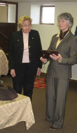 George Washington visits the Columns Photos provided Phyllis D. receives a plaque of appreciation from Martha D., Executive Director of GAIT TRC.
