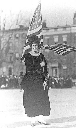 Cornelia Bryce Pinchot carrying American flag in New York City Suffragette Parade, c. 1917
