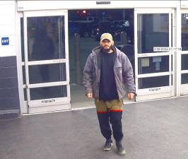 The police are looking for help in identifying this man in connection to a purse theft.