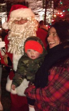 Santa arrives, the tree lights up, and all is well in Milford Santa gave candies and heard Christmas wishes (Photo by Anya Tikka)