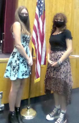 Juliana Llaurado (left) and Viktoria Sioreti at the Oct. 21 school board meeting (Photo by Frances Ruth Harris)