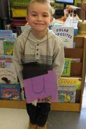 Kindergartners celebrate the union of 'Q' and 'U'! Groom Conner Spangenburg (Photo by Peggy Snure)