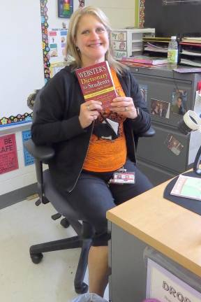 Mrs. Cassandra Zegarski, third-grade Zoom teacher, will be sending her students the book this week (Photo by Peg Snure)