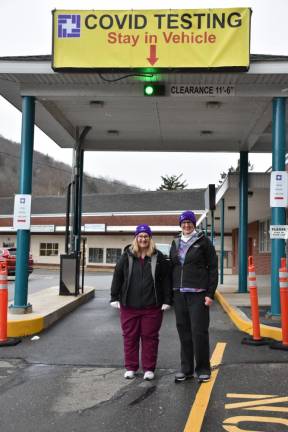 Lab Technologists Holly Meyer (left) and Nancy O’Connell at the COVID-19 drive-through testing site at the Stourbridge Complex, Honesdale, before dressing in their PPE (Photo provided)