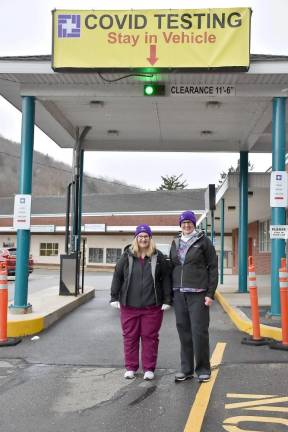 Lab Technologists Holly Meyer (left) and Nancy O’Connell at the COVID-19 drive-through testing site at the Stourbridge Complex, Honesdale before dressing in their PPE (Photo provided)