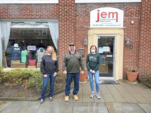 In front of JEM Screen Printing (from left): Connie Harvey, Commander of the American Legion Post; Gary Brennan, Service Officer, American Legion Post; and Susan Pfuhler, owner of JEM.