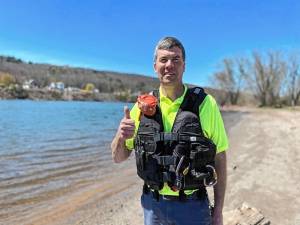 Assistant Director of Public Works for the City of Port Jervis Wayne Addy promoting “Wear Your Life Jacket to Work Day” at West End Beach.