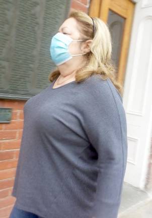 Rosemary Curwood, John Curwood's wife, enters the Pike County Courthouse for her husband's sentencing hearing (Photo by Frances Ruth Harris)