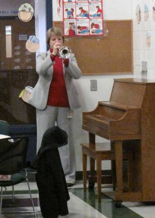 Shohola students give thanks to veterans Mrs. Susan Apgar plays Taps for those attending the Veteran's breakfast