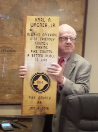 Karl Wagner Jr. is appointed to library board Karl Wagner displays a plaque he received upon his retirement as county commissioner in 2015 (Photo by Frances Ruth Harris)