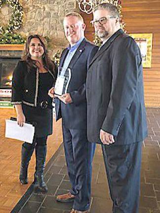 From left: Christine A. Wilkins, president/general manager; James Martin, realtor; and William Schutte, executive vice president