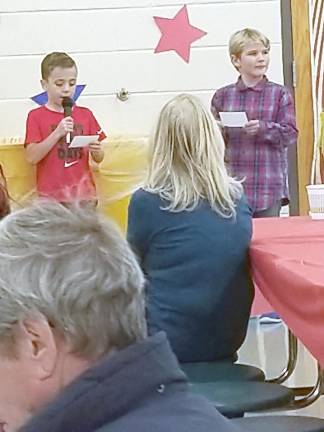 Students deliver an appreciation speech to veterans.