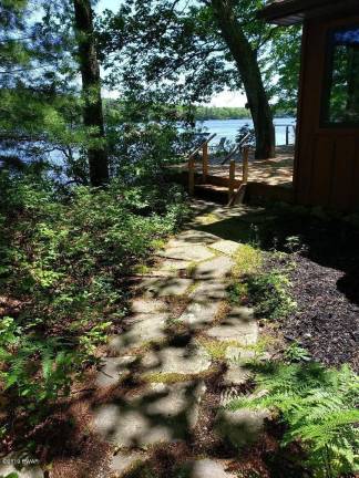 Four-bedroom lakefront contemporary is just steps from beach Path