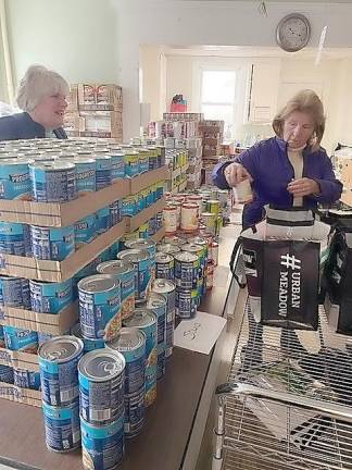 Volunteers fill bags at the Ecumenical Food Pantry of Pike County.