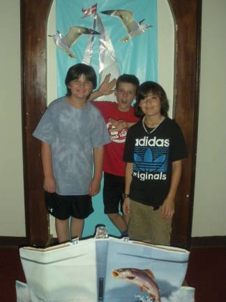 St. Patricks Church hosts Vacation Bible Camp Delaware Valley 3rd graders Will Seidel and German Dircio standing by craft display.