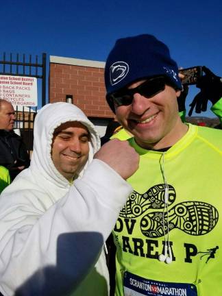 Half-marathon runners raise $12K for Special Olympics Ryan Chickeletti (left) encourages Anthony Comunale (right) before the marathon begins (Photo provided)