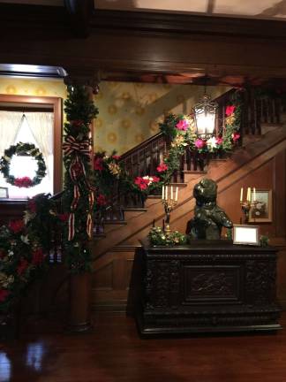 The bannister is made splendid with decoration from the Milford Garden Club (Photo by Linda Fields)
