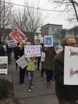 At marches, did police presence make the difference? Marchers in Milford on Inauguration day (Photo by Linda Fields)