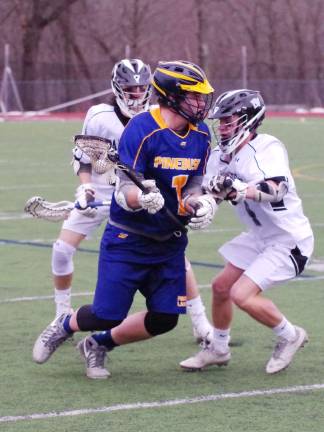 Delaware Valley Warriors take down Pine Bush Bushmen in lacrosse Pine bush player David Degroot with the ball as Delaware Valley defenders close in