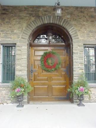 A welcoming door, decorated for the season