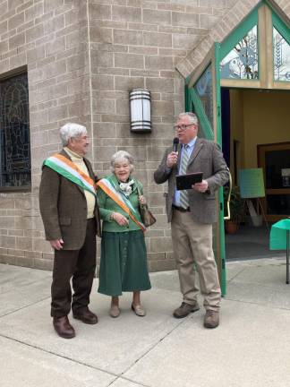 Grand marshals Ken Corcoran and Pat Corcoran with Council President Joe Dooley.