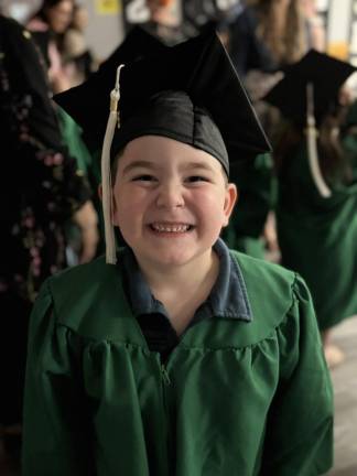 Pre-K grads celebrate moving up Brendan Freely celebrates his graduation.