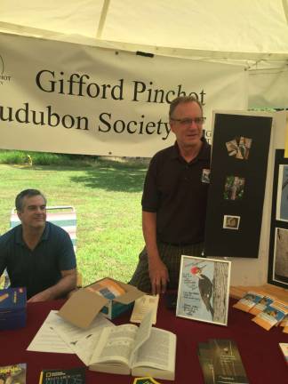 Visitors carve out time for wood fest Peter Wulfhurst (right) and Randall Brown (seated)