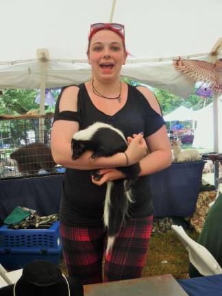 Festival of Wood promotes importance of forests Ali Machirone of Pocono Wildlife Rescue holds a skunk that - luckily - has been de-scented.