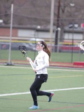 DVH Warriors defeat Hazleton Cougars in Girls Varsity Lacrosse Delaware Valley Warrior Faith Fucetola with the ball