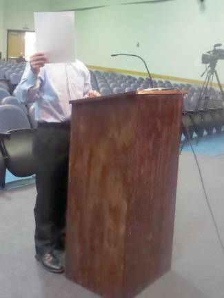 When the Courier took this picture of Dominick Agron, he held a piece of paper in front of his face and kept speaking.(Photo by Frances Ruth Harris)