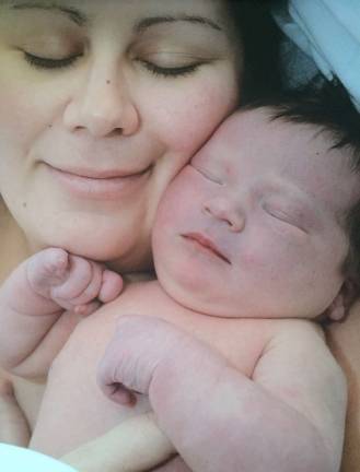 Mother Daughter Look A Like Contest Photo submitted by Randi Adamitis of Vernon First Place winner - "Mommy and Mallory. Taken at the hospital just one day old."