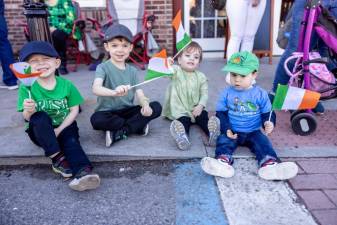 Noah, Gavin, Rory and Lorenzo support their dads who are part of the Hudson Valley Regional Police Pipes &amp; Drums from the sidelines of the Port Jervis St. Patrick’s Day Parade. Photo by Sammie Finch